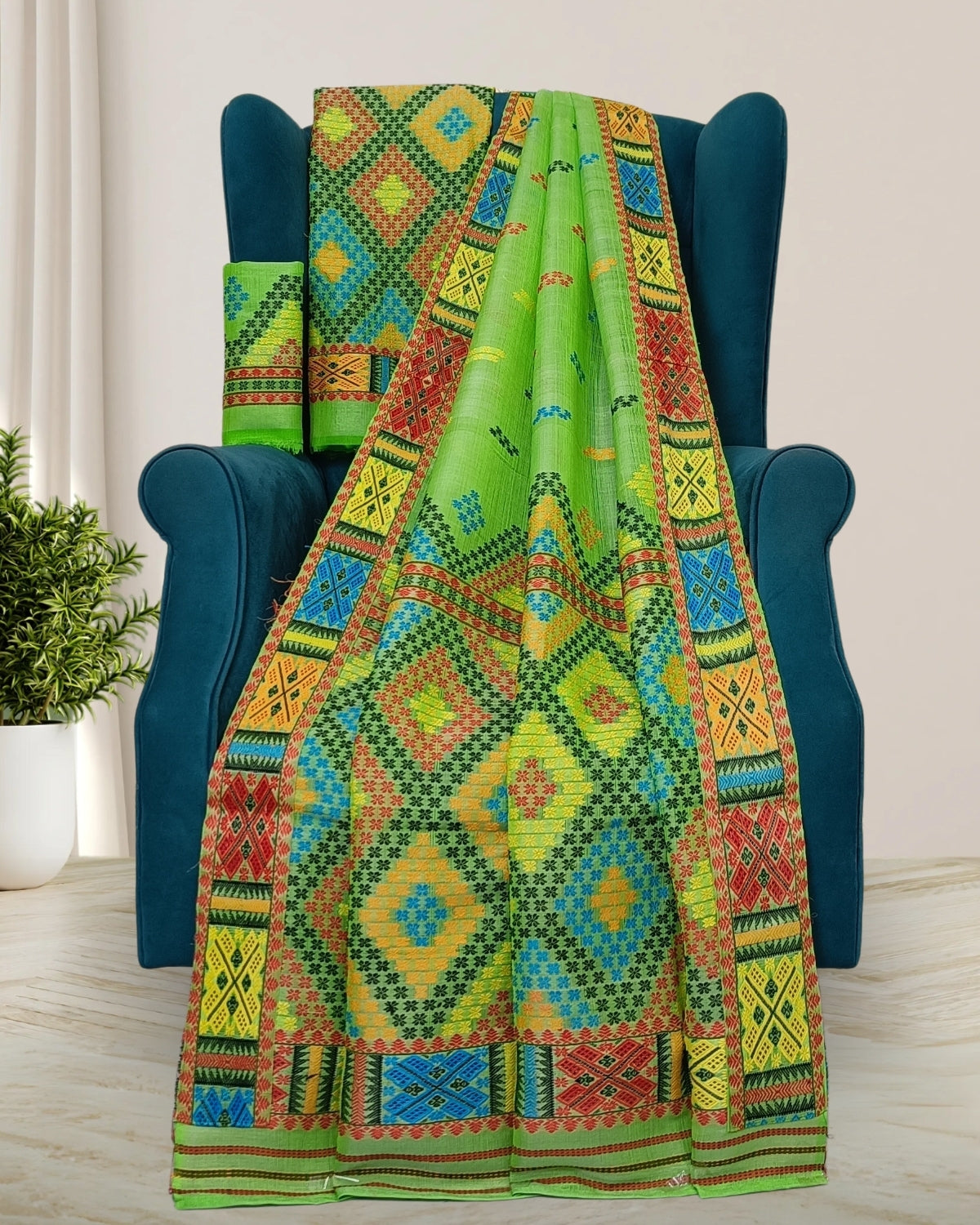 Green semi nuni Mising mekhela sador - DMC motifs