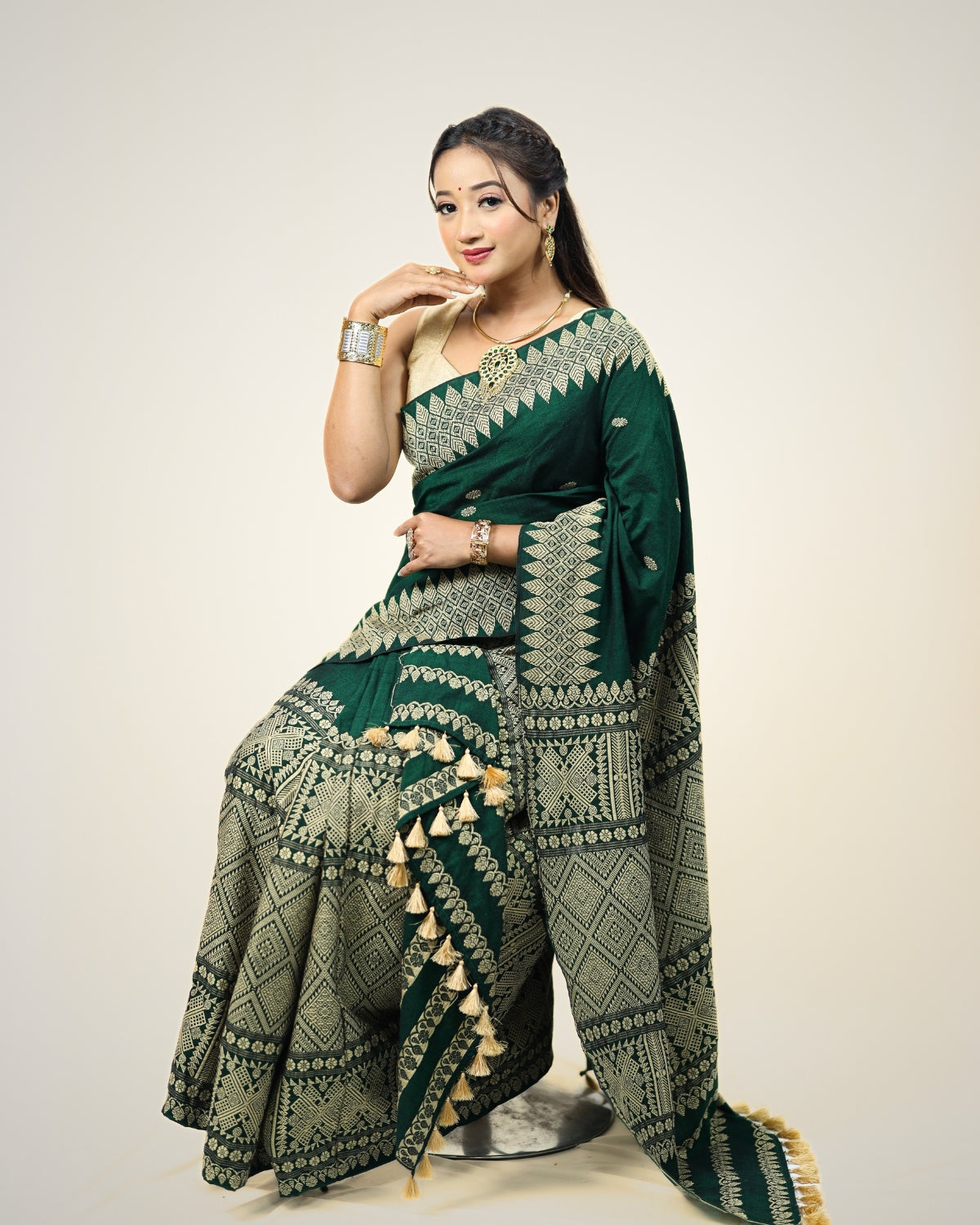 Forest green padmini cotton mekhela sador with designer motifs