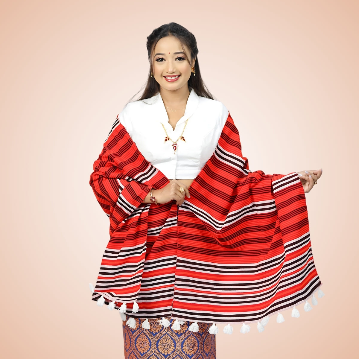 Girl wearing traditional red Mising shawl