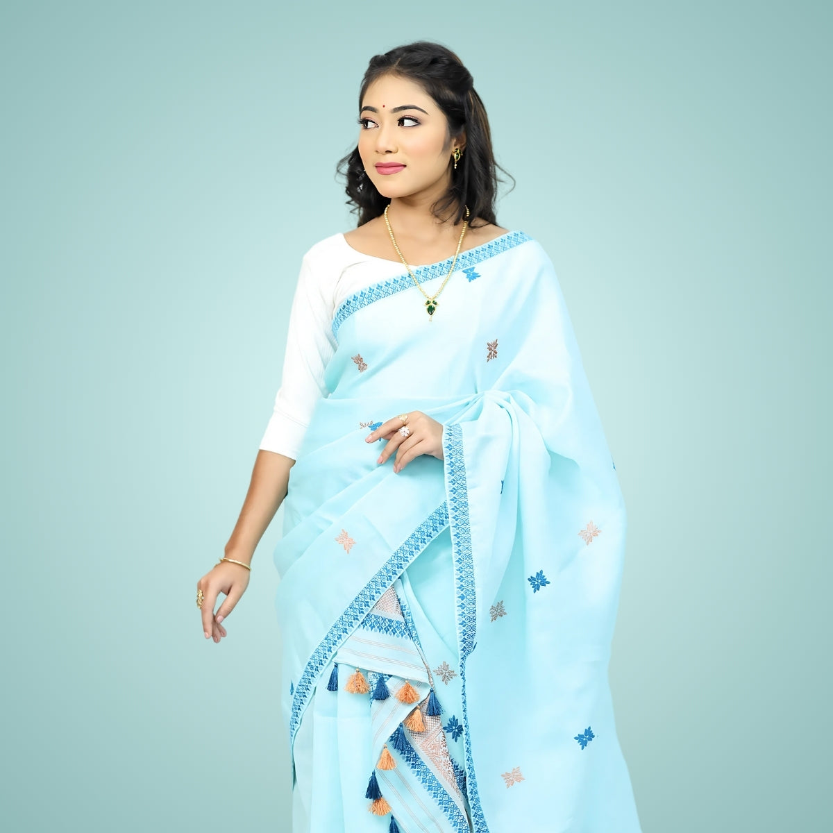 Women in blue color Assamese mekhela sador