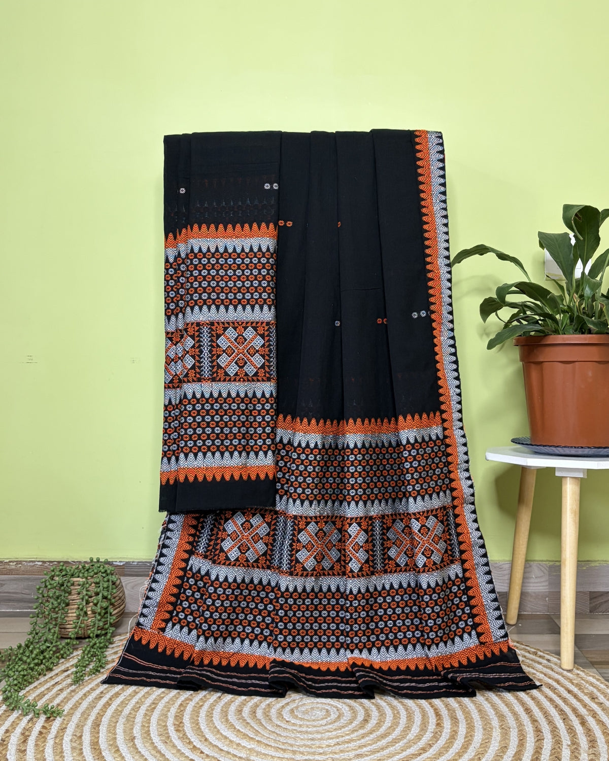 Black padmini cotton mekhela sador with designer motifs