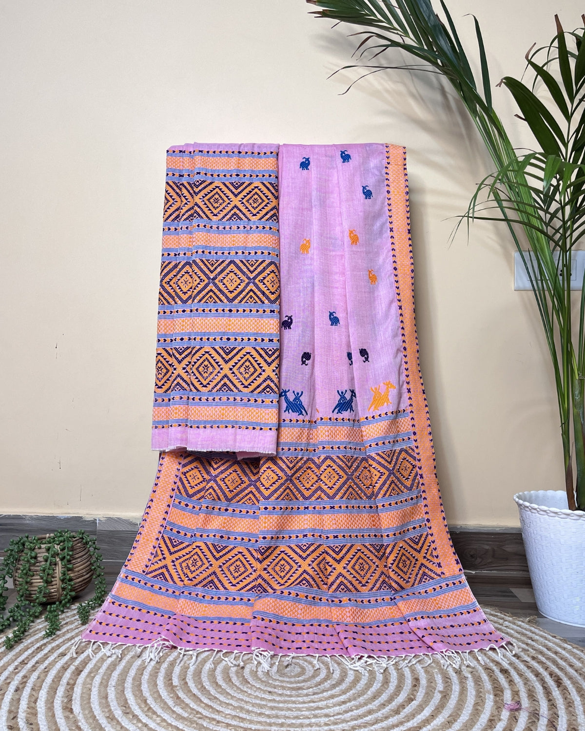 Pink padmini cotton mekhela sador with designer motifs